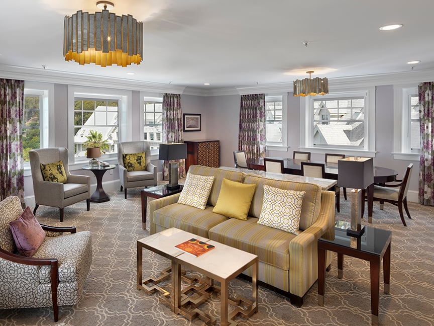 The living area and dining area of the Signature Bayview One Bedroom Suite at Claremont Club & Spa.