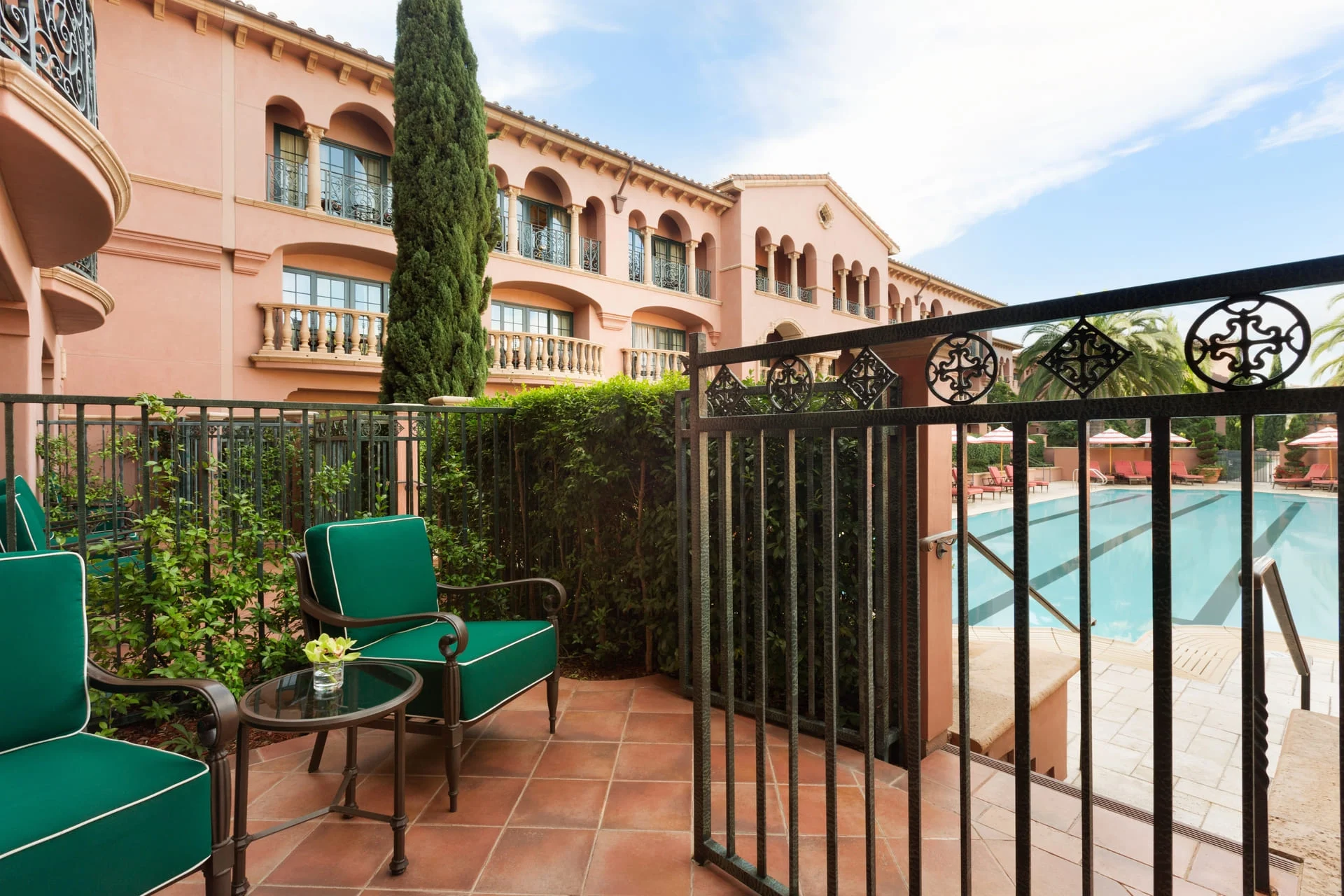 The pool seating area at the Signature Poolside Adult Only Room at Fairmont Grand Del Mar.