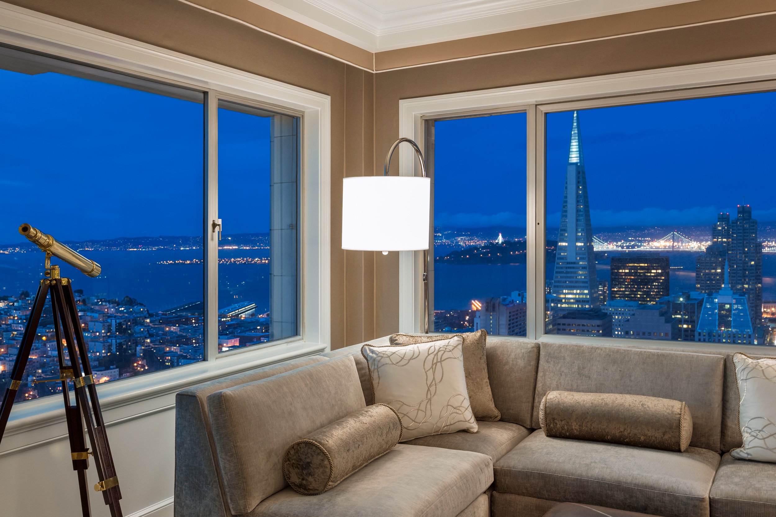 The view of the city at night from the Signature Golden Gate Suite at Fairmont San Francisco.