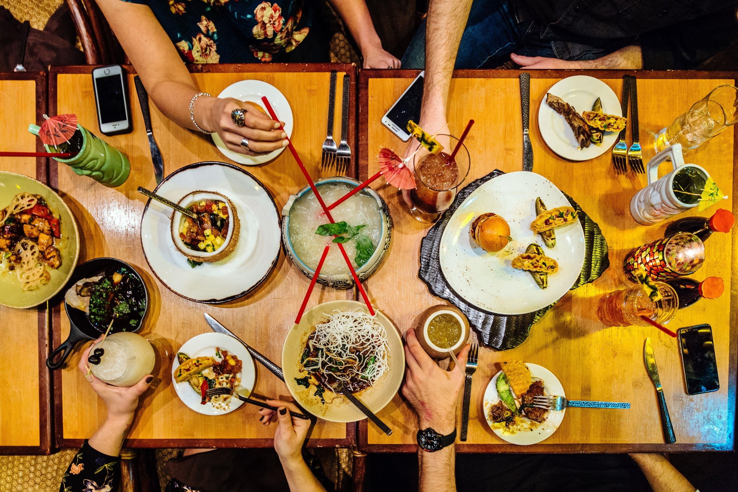 Looking down on a group of people dining.