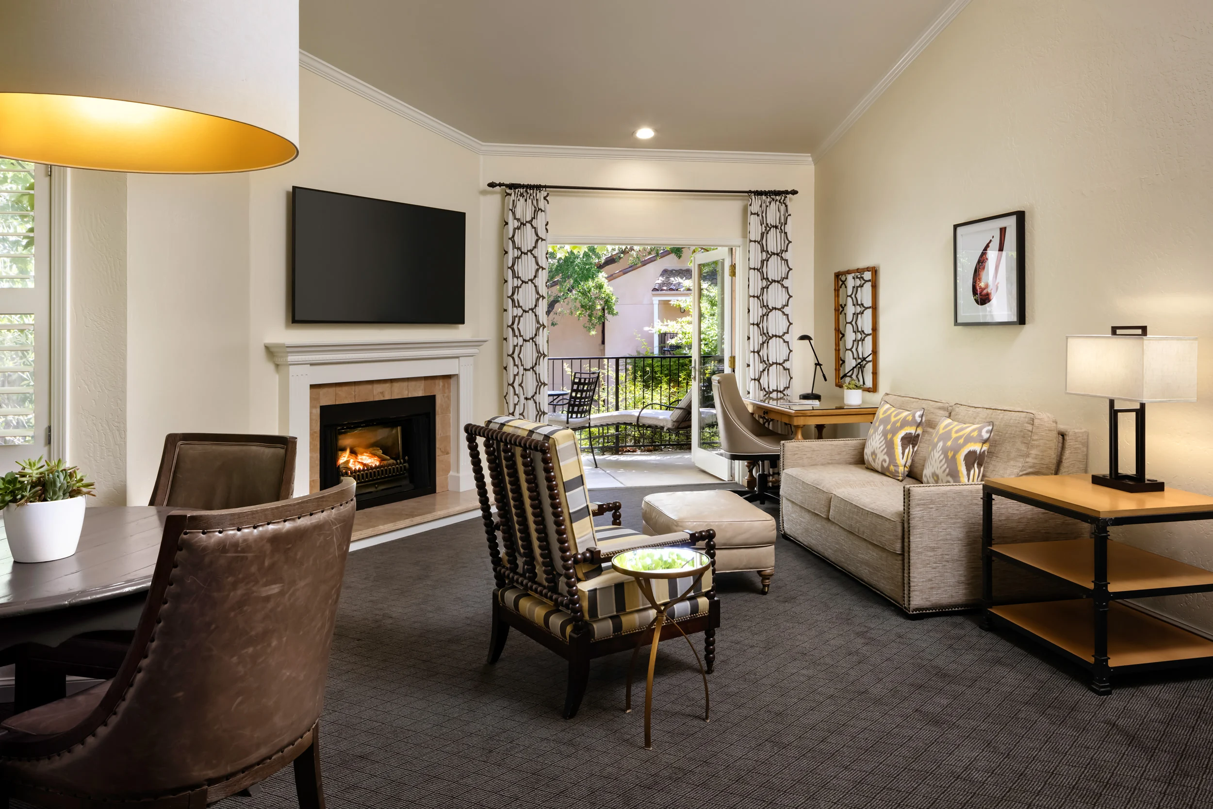 The seating area and balcony of the Jack London Suite at Fairmont Sonoma.