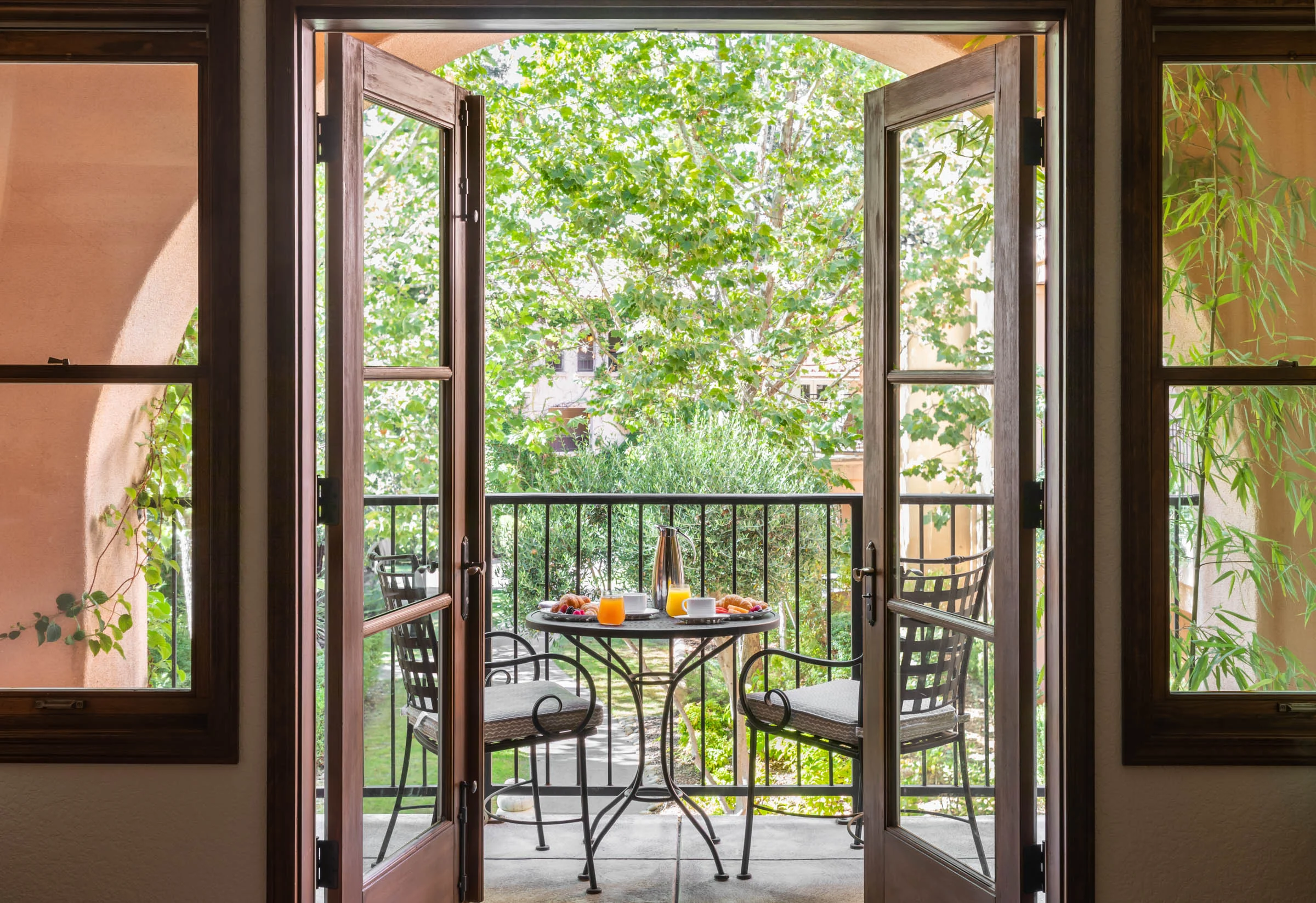 Breakfast served on a patio table on the balcony of the Mission Spa Suite at Fairmont Sonoma.